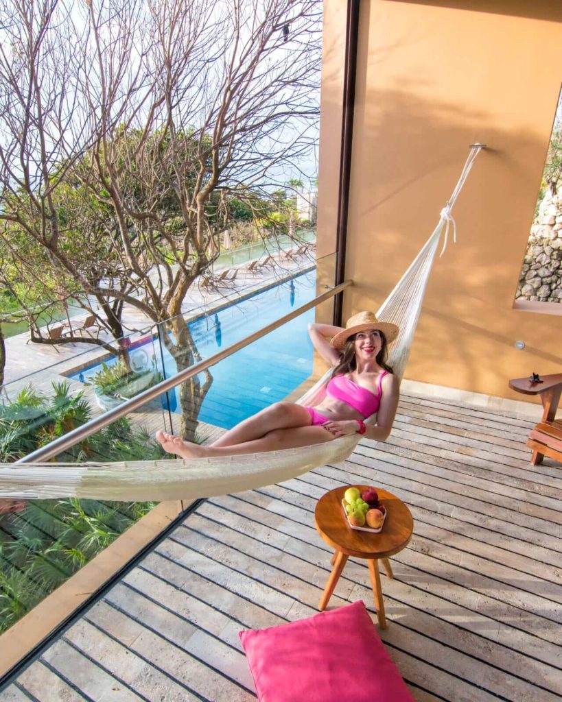 Girl hanging in hammock in suite at Hotel Xcaret Mexico