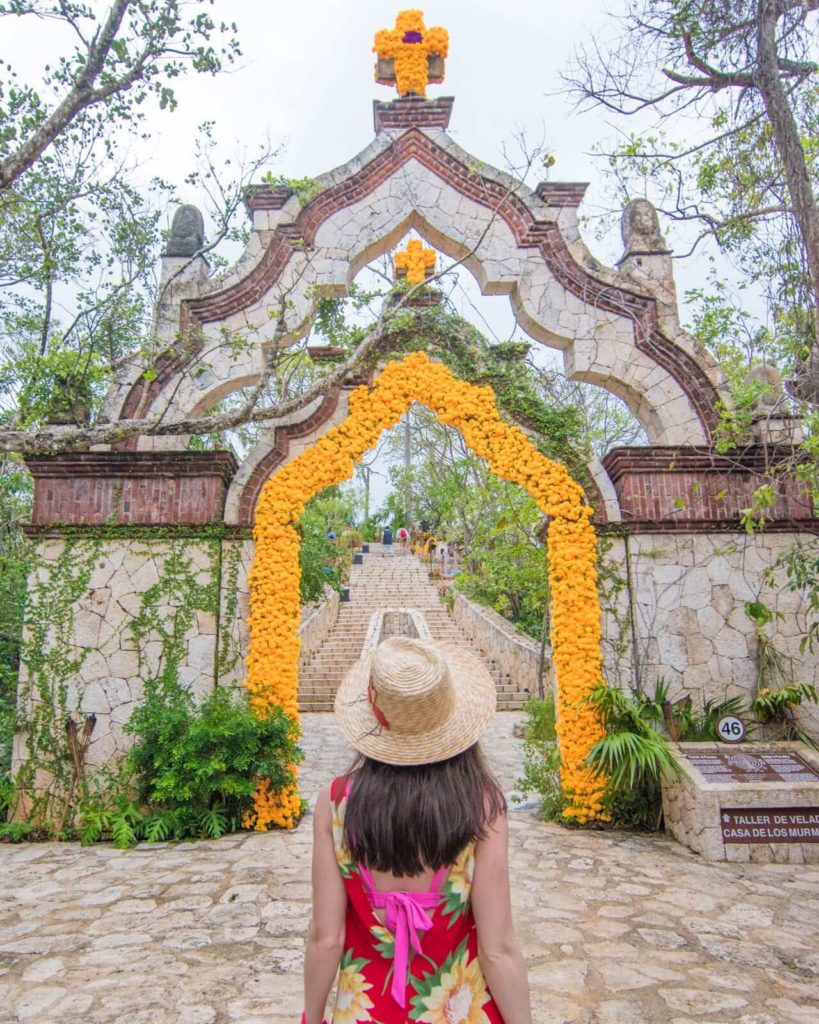 Girl in front of arch in the Mayan village at Xcaret Park
