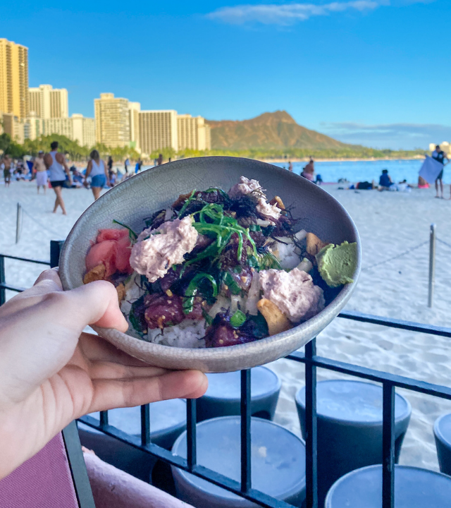 Hawaiian poke bowl with a view of Diamond Head and Waikiki Beach