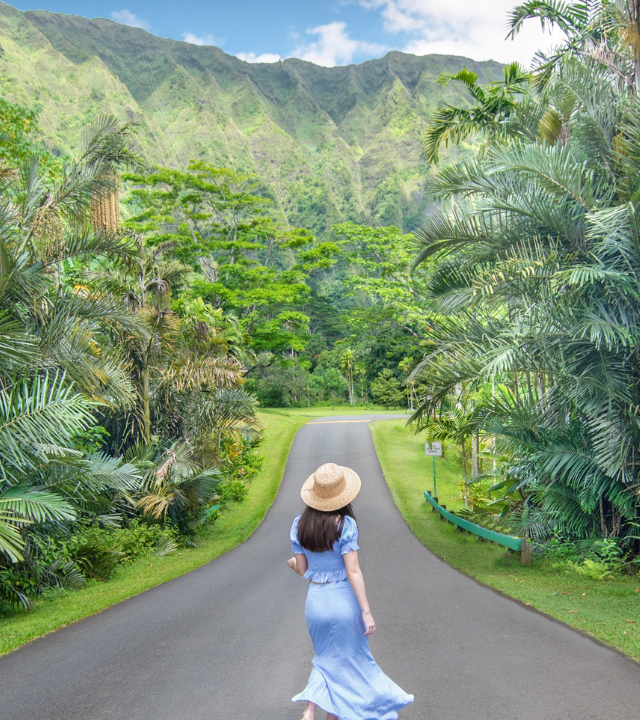 Woman walking in Ho'omaluhia Botanical Garden in Oahu, Hawaii.