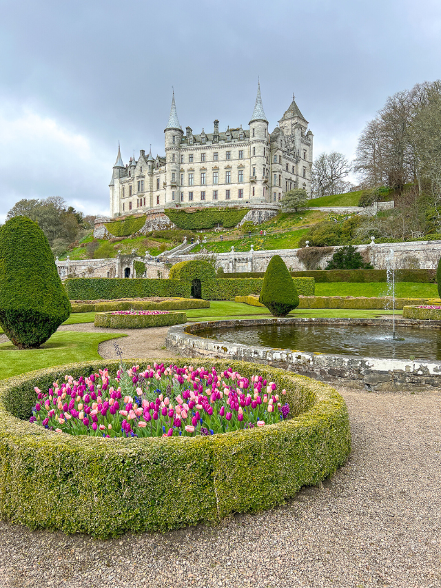 Dunrobin Castle in the Scottish Highland, showing the castle gardens and the castle in the background.