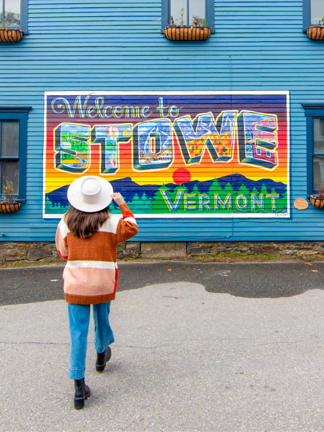 Woman walking with back to camera in front of the 